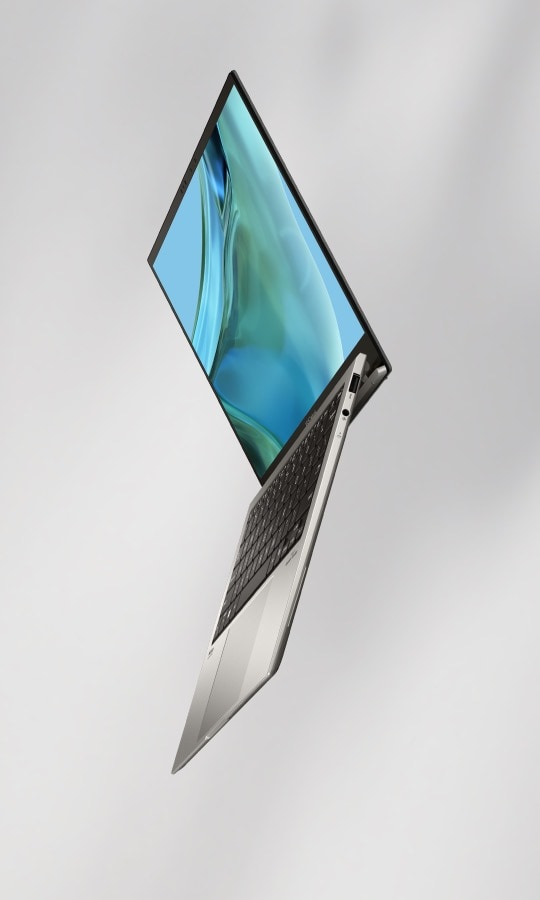 Asus Zenbook S 13 OLED at a vertical angle, lid partly open, showing the slim profile and the OLED display with a teal abstract wallpaper.